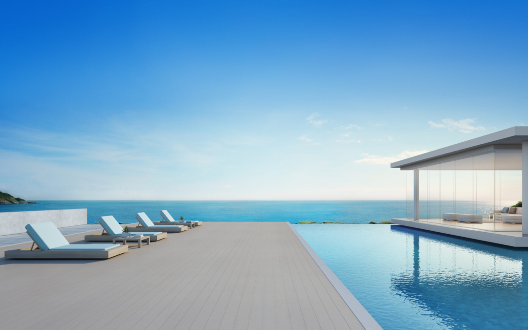 Luxury beach house with sea view swimming pool and terrace in modern design, Lounge chairs on wooden floor deck at vacation home or hotel – 3d illustration of contemporary holiday villa exterior